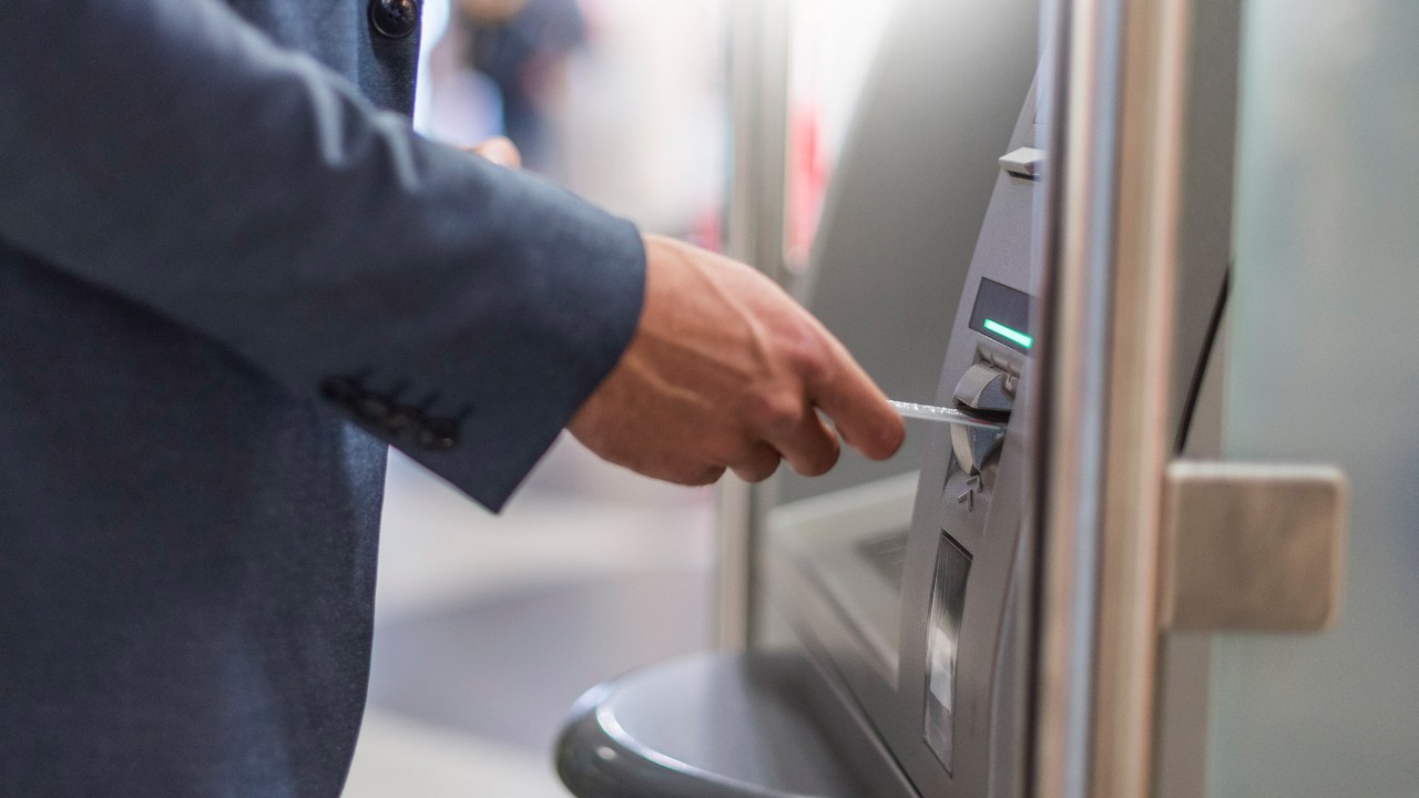 A man using atm; image used for HSBC Singapore Express banking ATM Service.