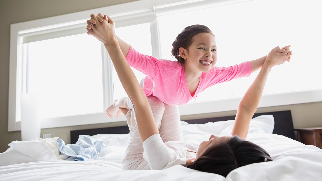 Mother is doing Yoga with daughter, image used for HSBC Mortgage to refinance my home loan