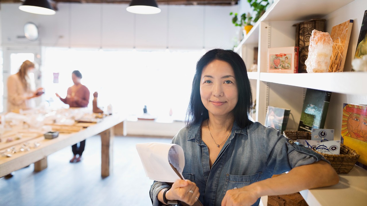 A woman is in her shop; image used for HSBC Singapore Investment Property Loan