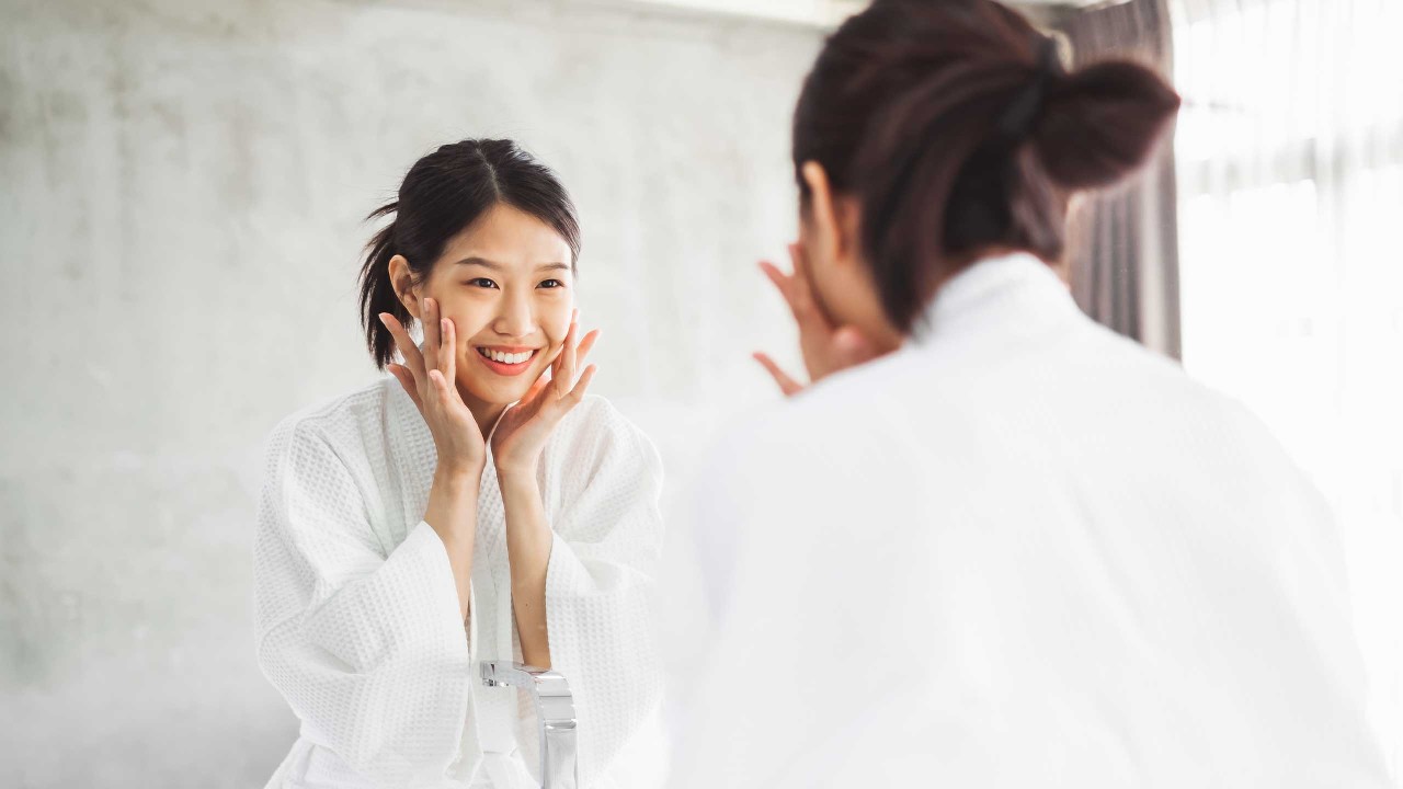 Woman cleaning her face
