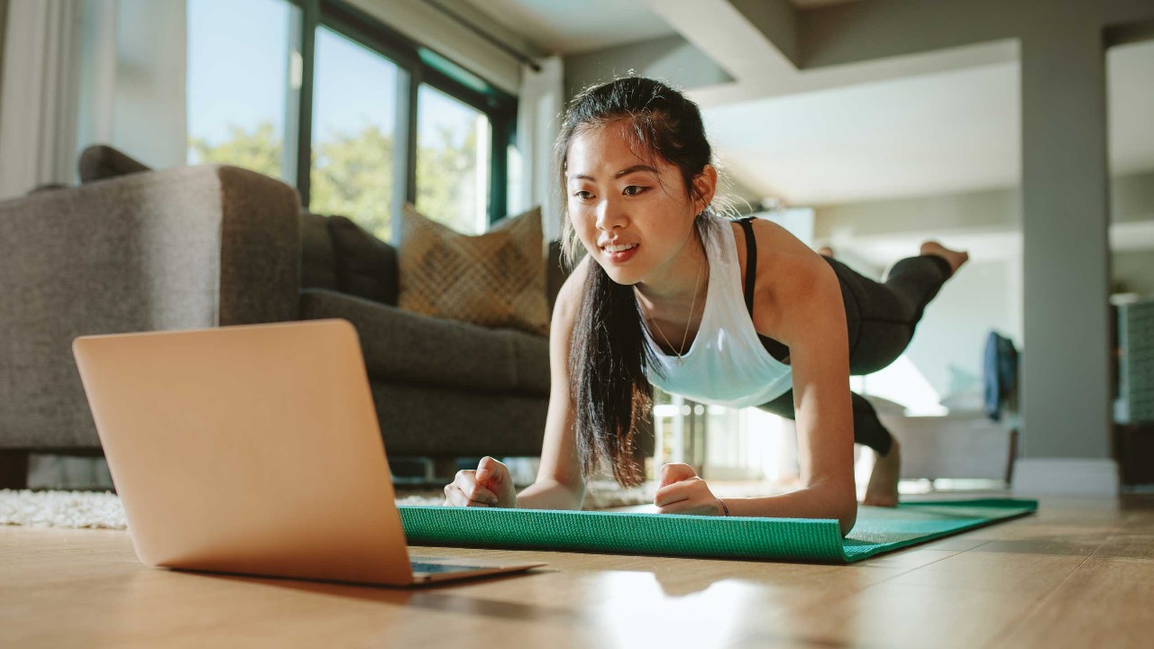 Woman watching sport training video