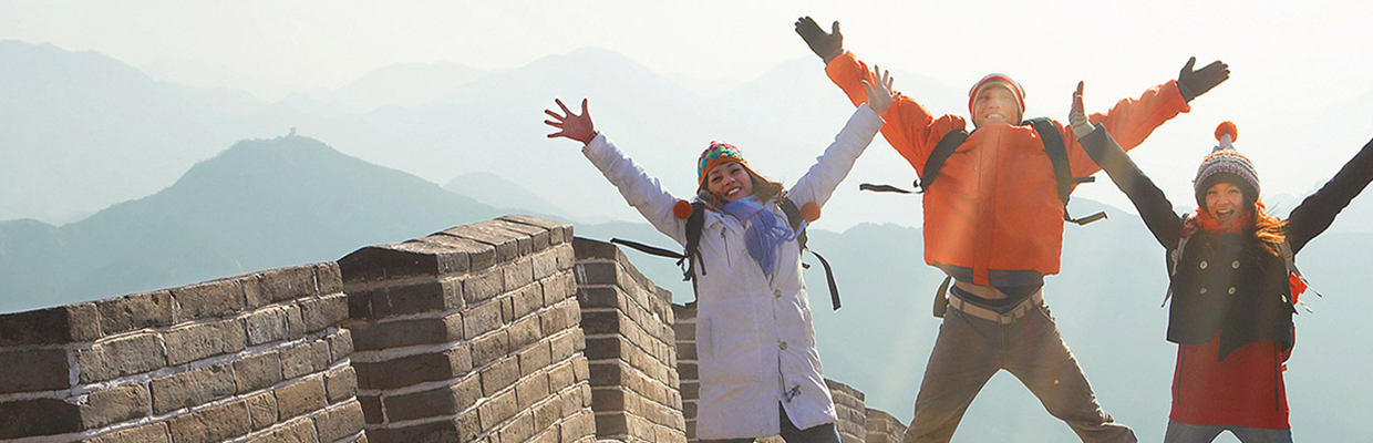 Cheerful group of friends on the bridge; image used for Credit Card Balance Transfer Page.