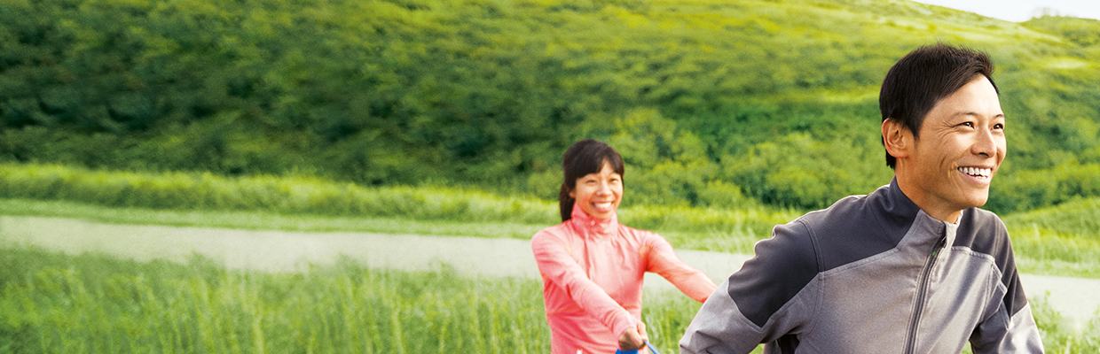 A man and woman are excercising; image used for HSBC Singapore Insurance Value Life Insurance Plan