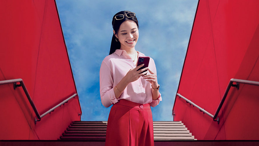 Woman looking at HSBC Singapore app on mobile