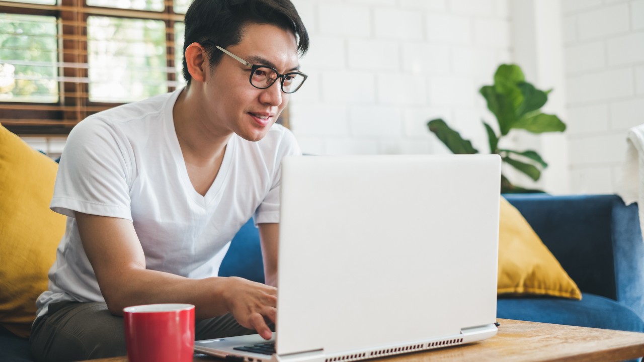 Man using laptop at home