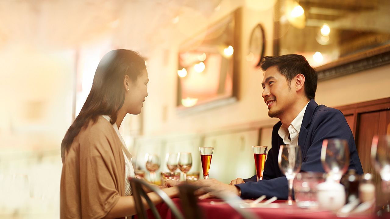 A woman and a man in a restaurant