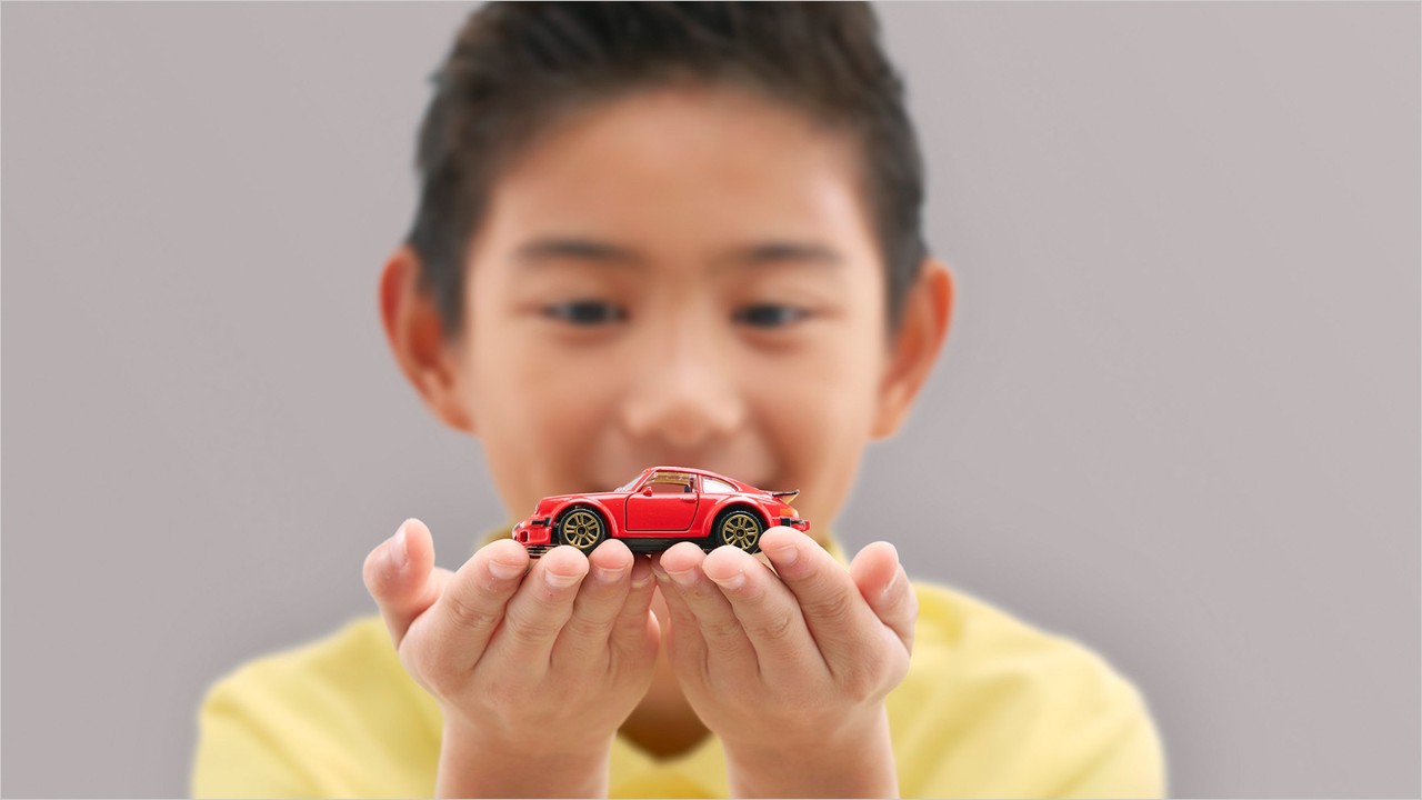 A boy with a toy car