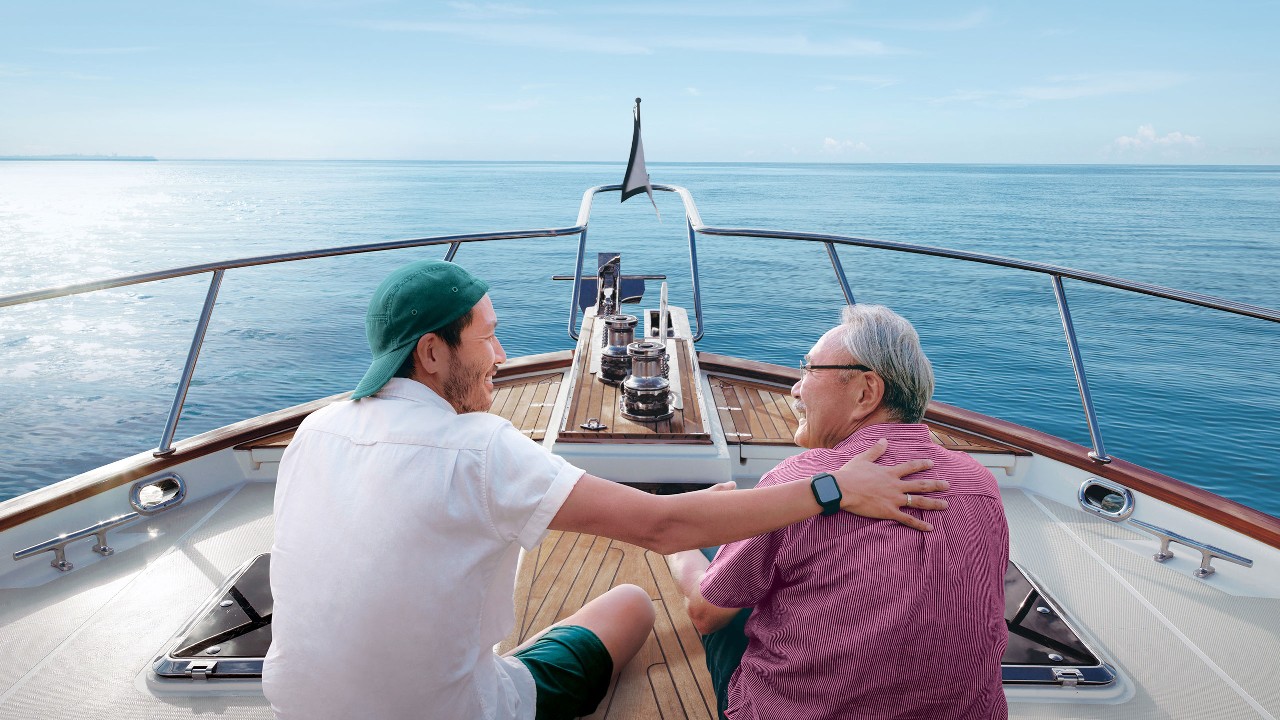 Father and son having good time on the boat.