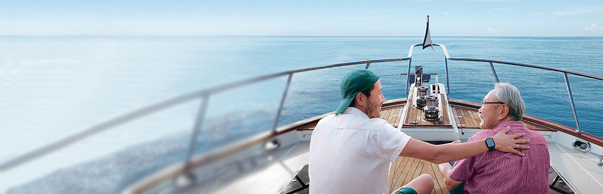 Father and son having good time on the boat; image used for HSBC Singapore Emerald Legacy Life II.