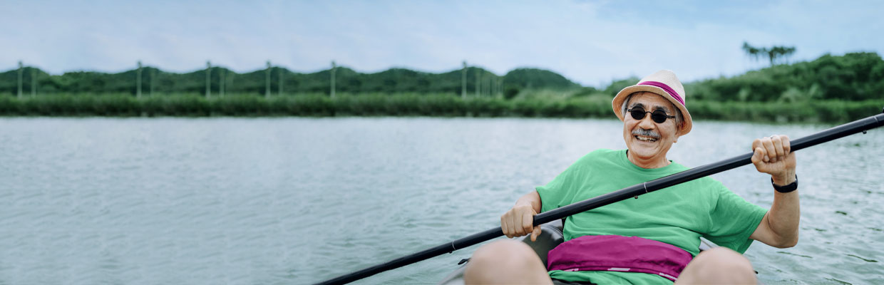 A man paddling kayak through river; image used for HSBC Life Retirement Income II.