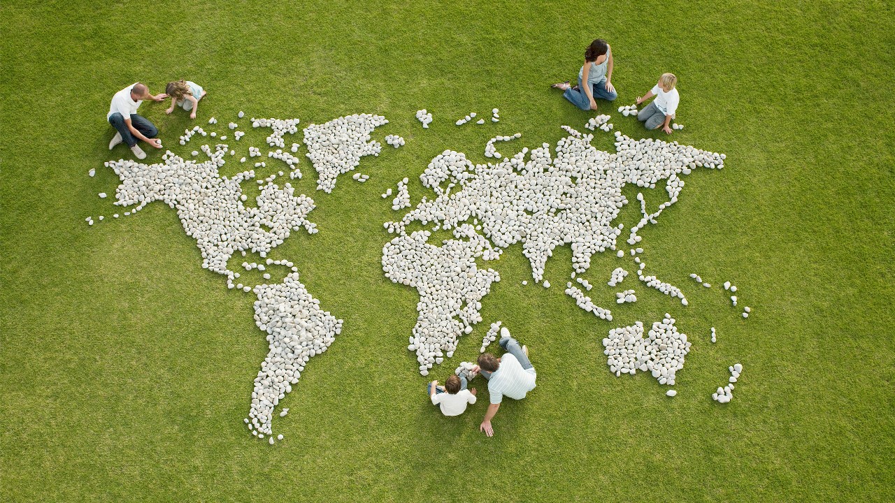 Parents and children making world map.