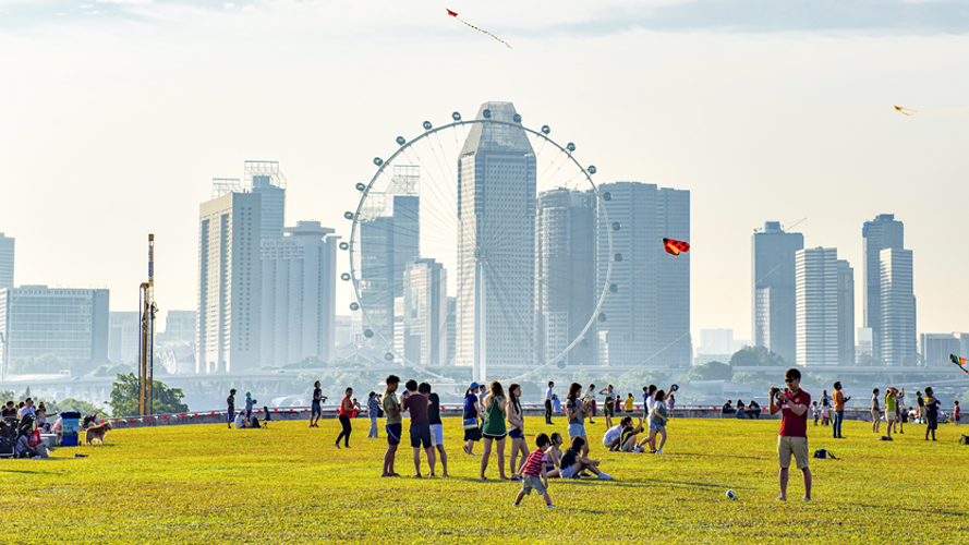 A ferris wheel in front of the Singapore skyline; image used for HSBC Singapore Expat Services.