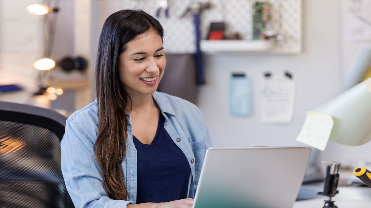 Woman using laptop.