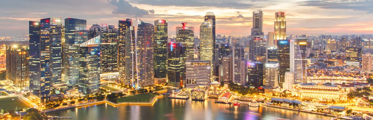 Illuminated office buildings; image used for HSBC Why Singapore's a great place to live and invest in article page.