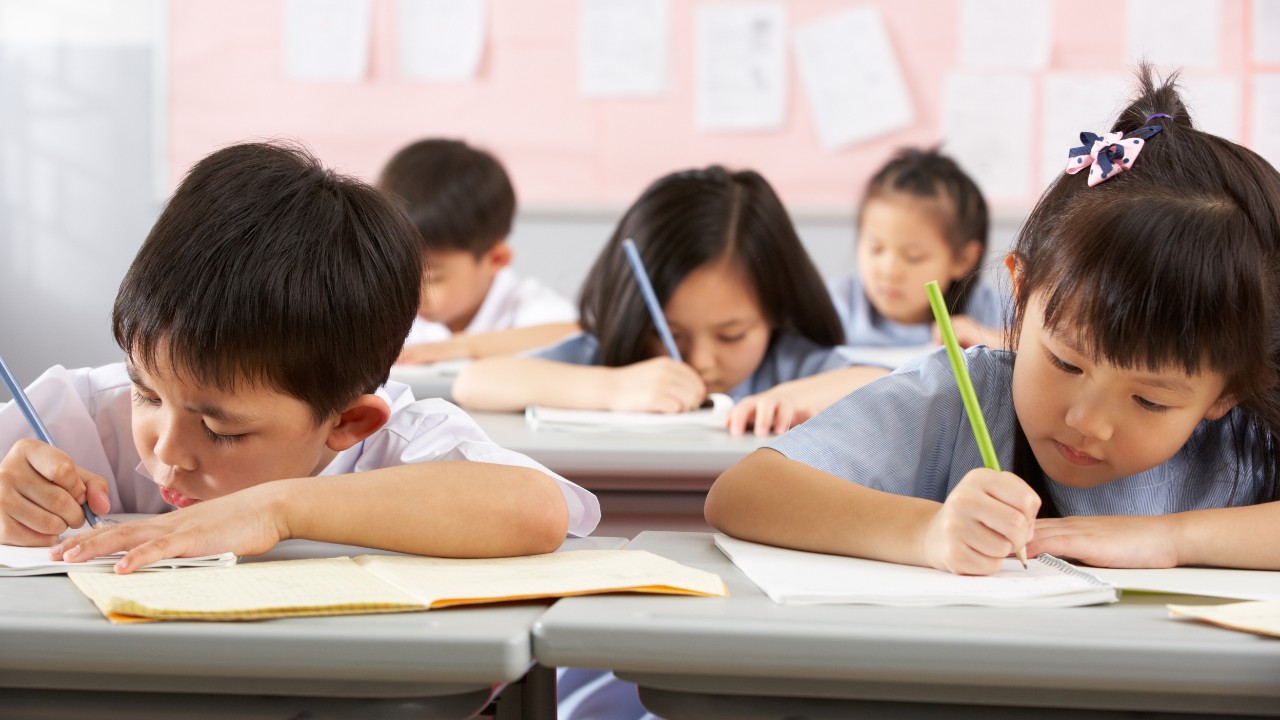 Group of children studying in classroom; image  used for HSBC Singapore  Understanding Singapore's school system article.