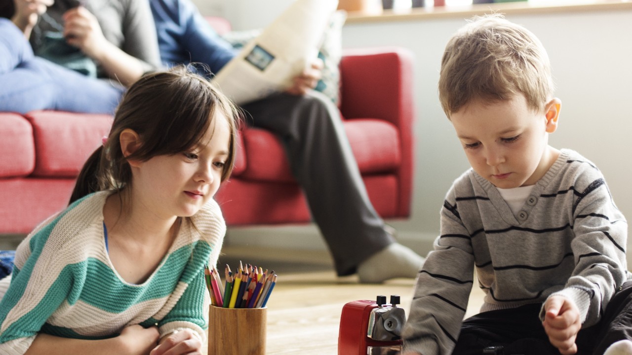 Two children are drawing; image used for HSBC Singapore Protection for you and your family article