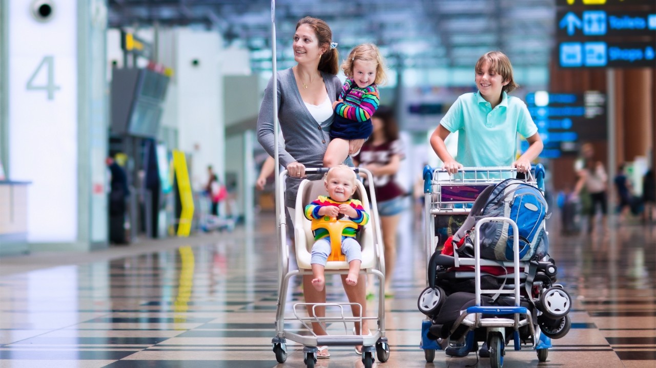 Mother with three children in airport