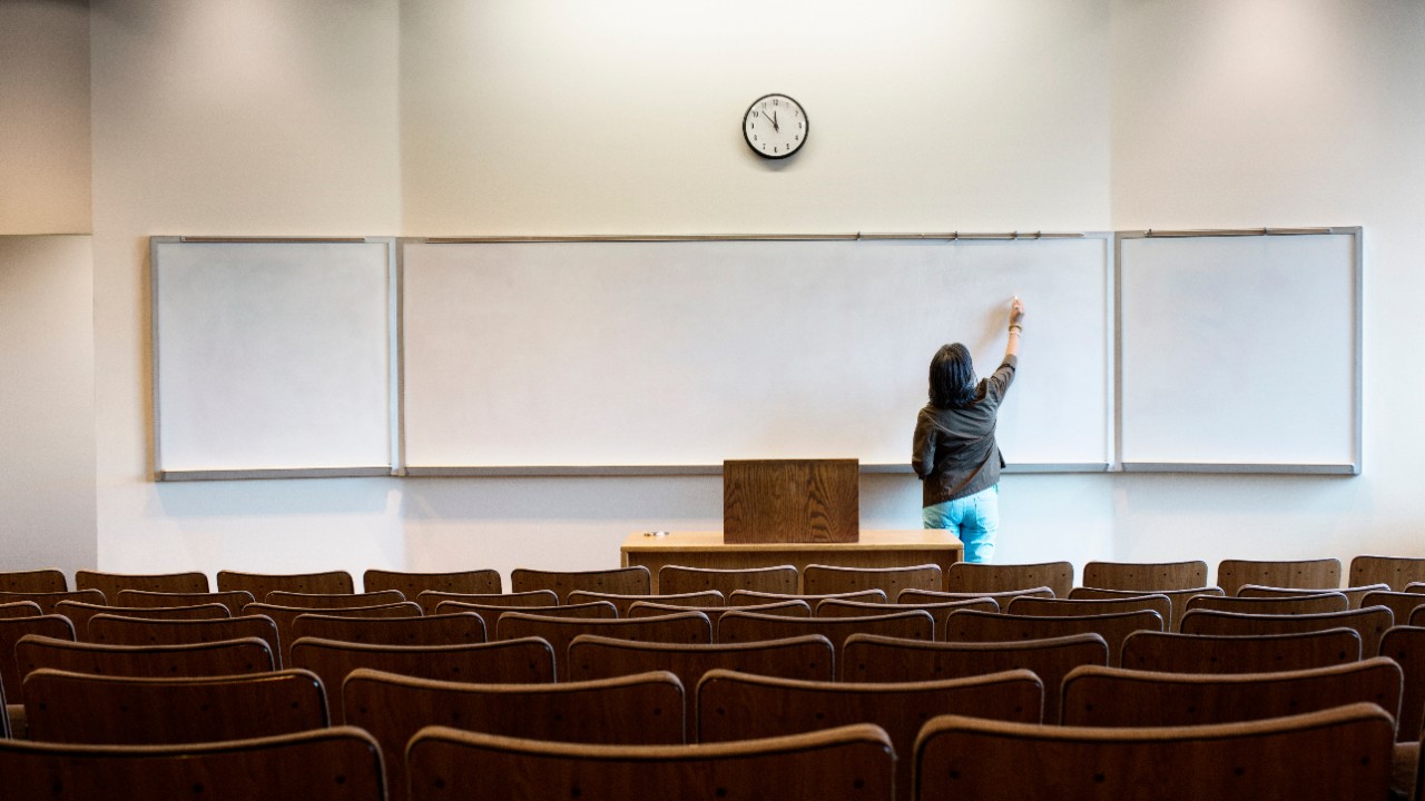 A teacher in a classroom; image used for HSBC Singapore Four education options for your children article