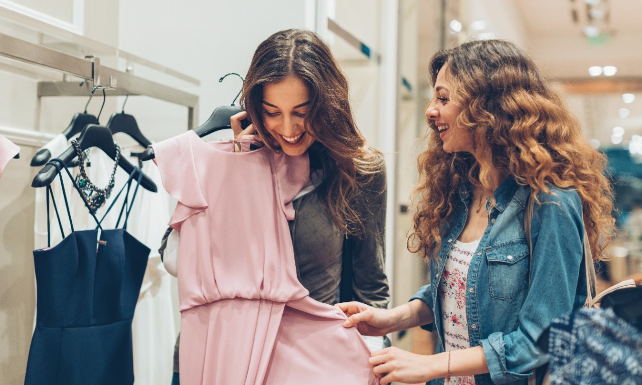 Two women shopping for dresses