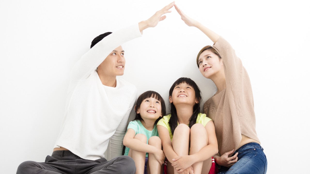 a family sit together to play; image used for Our Parents The Unsung Heroes Behind Every Home