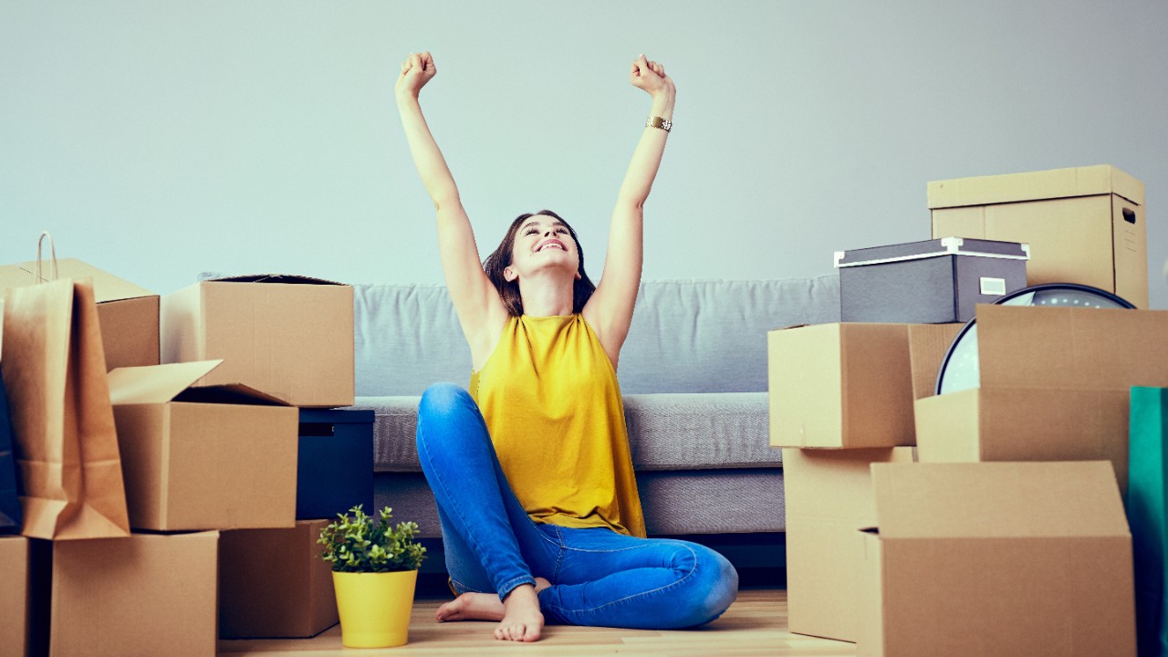 Woman stretching in living room; image used for best neighbourhoods in Singapore for singles